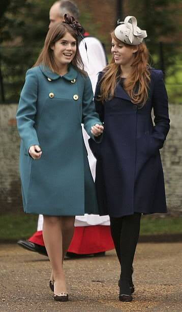 A picture of Princesses Beatrice and Eugenie in festive Christmas Day outfits.