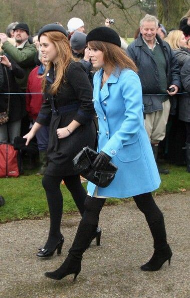 A picture of Princesses Beatrice and Eugenie in festive Christmas Day outfits.