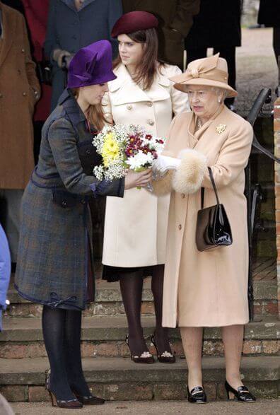A picture of Princesses Beatrice and Eugenie in festive Christmas Day outfits.