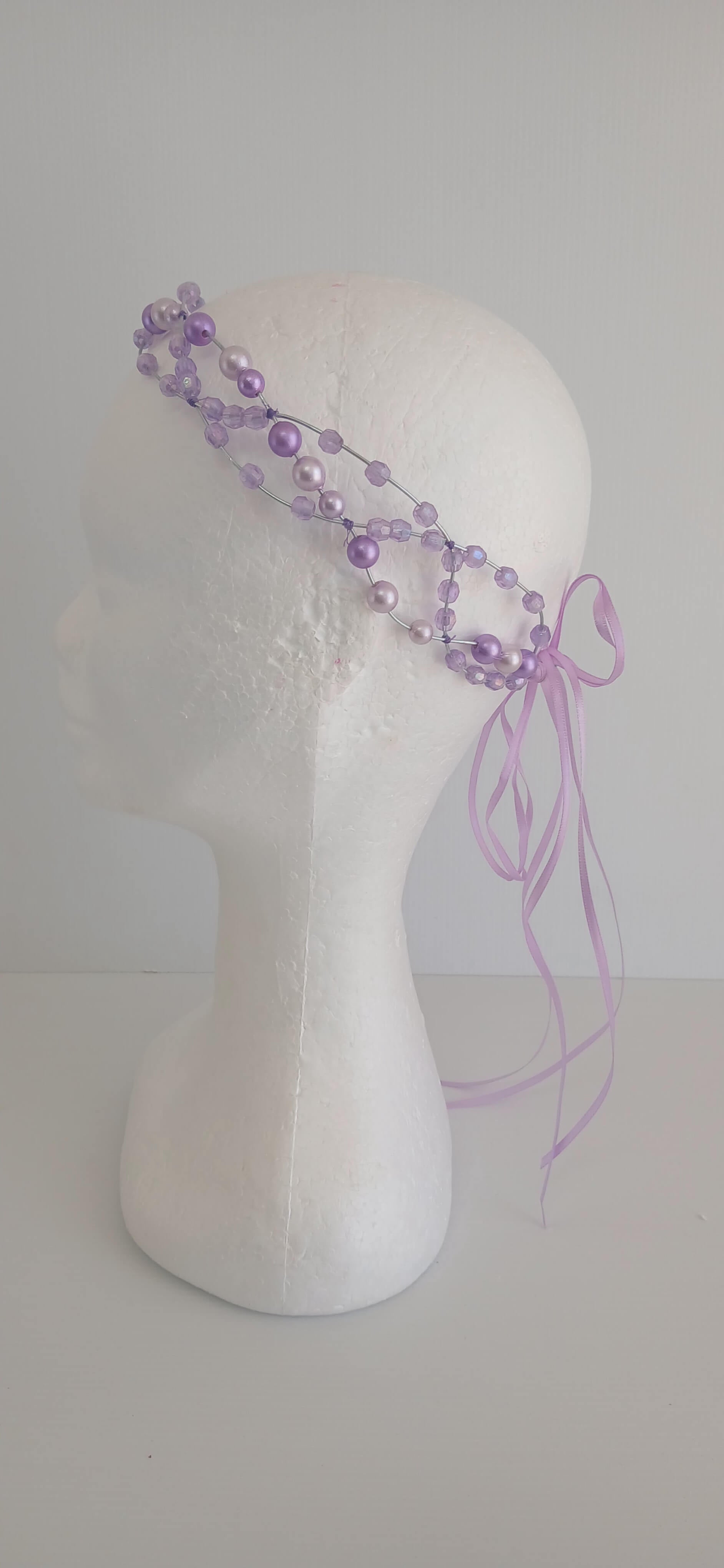 An image of the  Purple Beaded Halo Headband by Melissa Rath Millinery