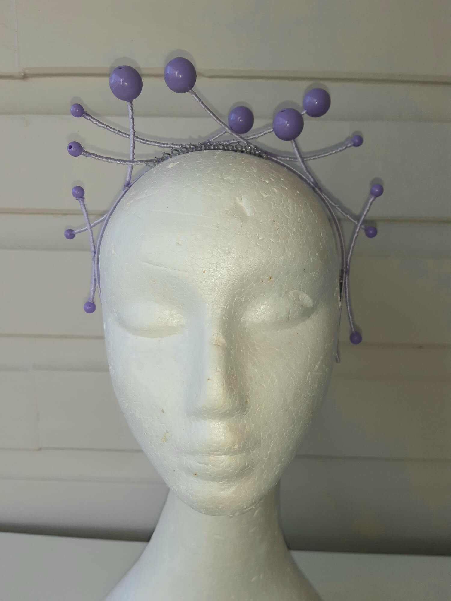 A picture of a purple beaded millinery headband by Melissa Rath Millinery.