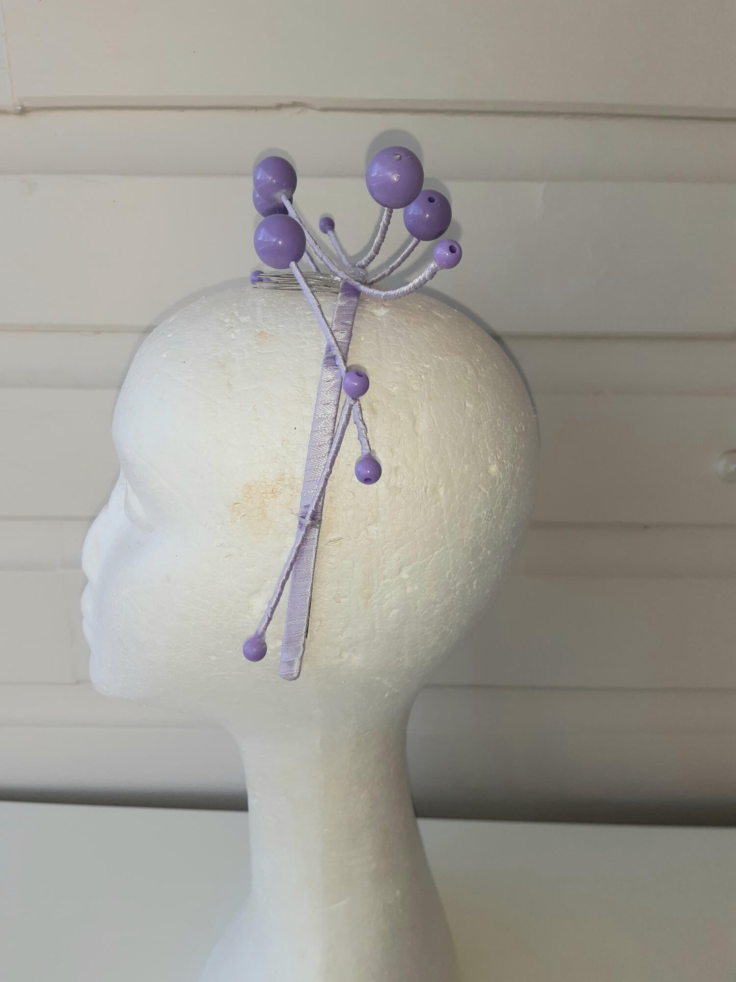 A picture of a purple beaded millinery headband by Melissa Rath Millinery.