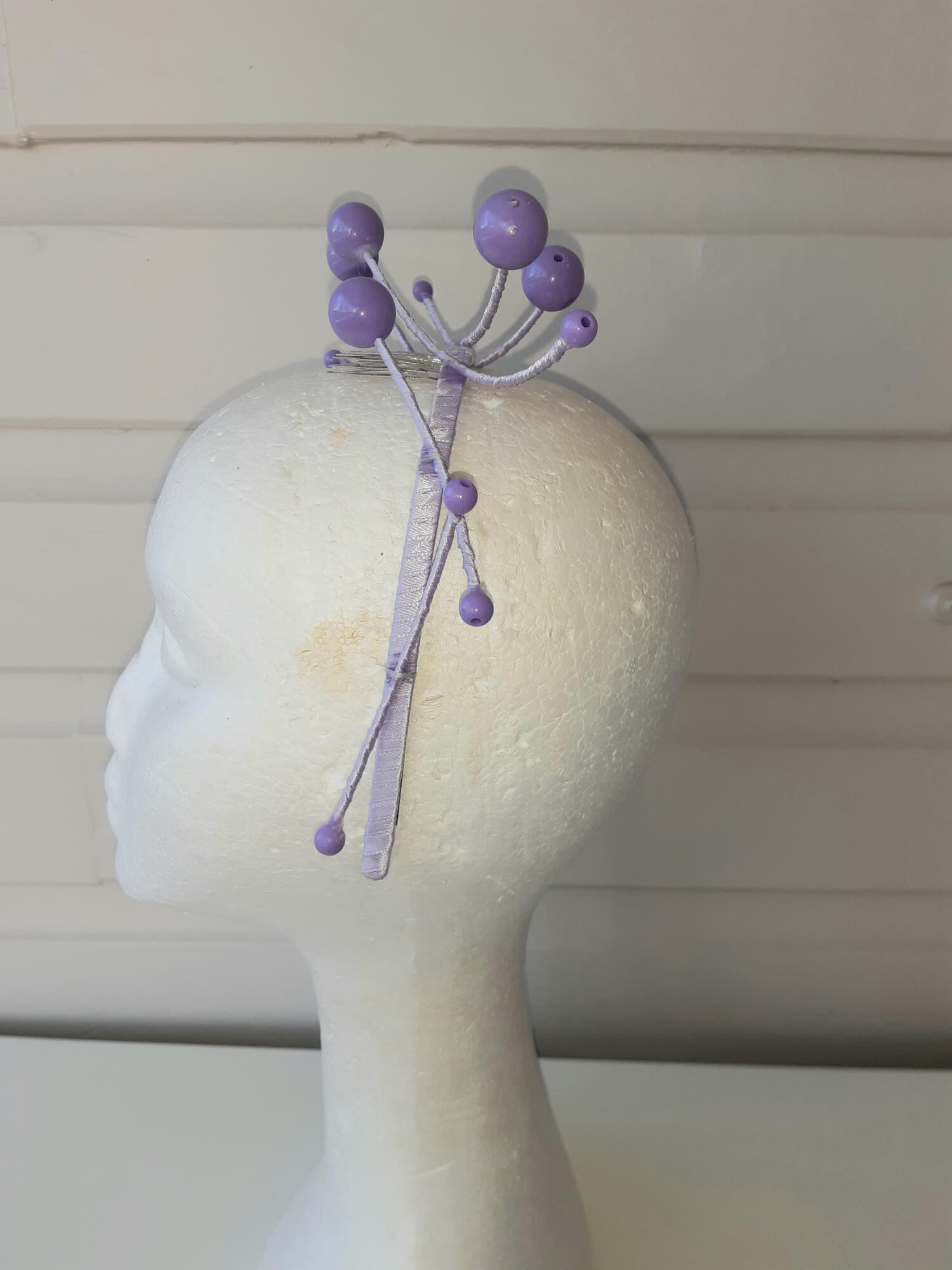 A picture of a purple beaded millinery headband by Melissa Rath Millinery.