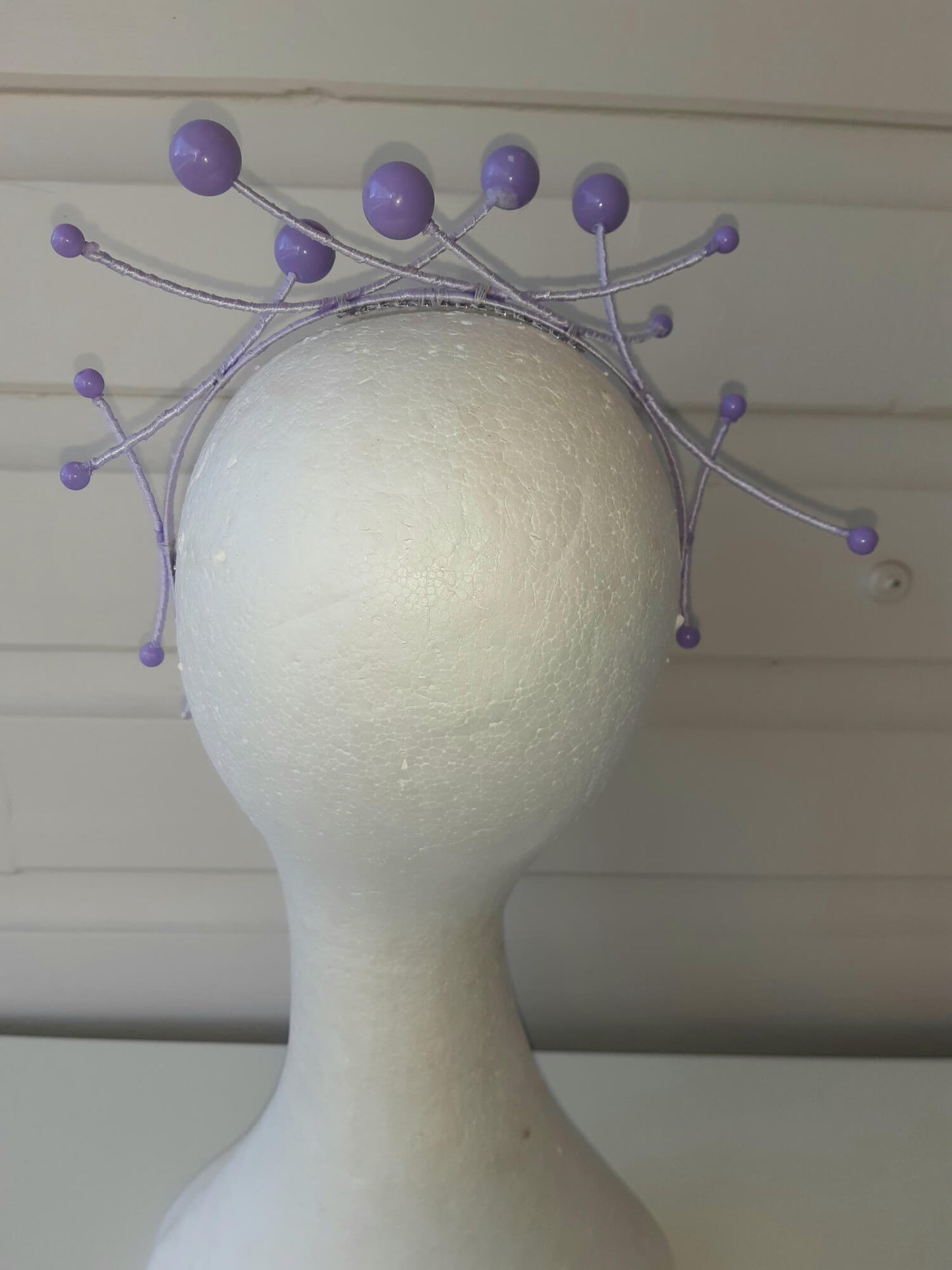 A picture of a purple beaded millinery headband by Melissa Rath Millinery.