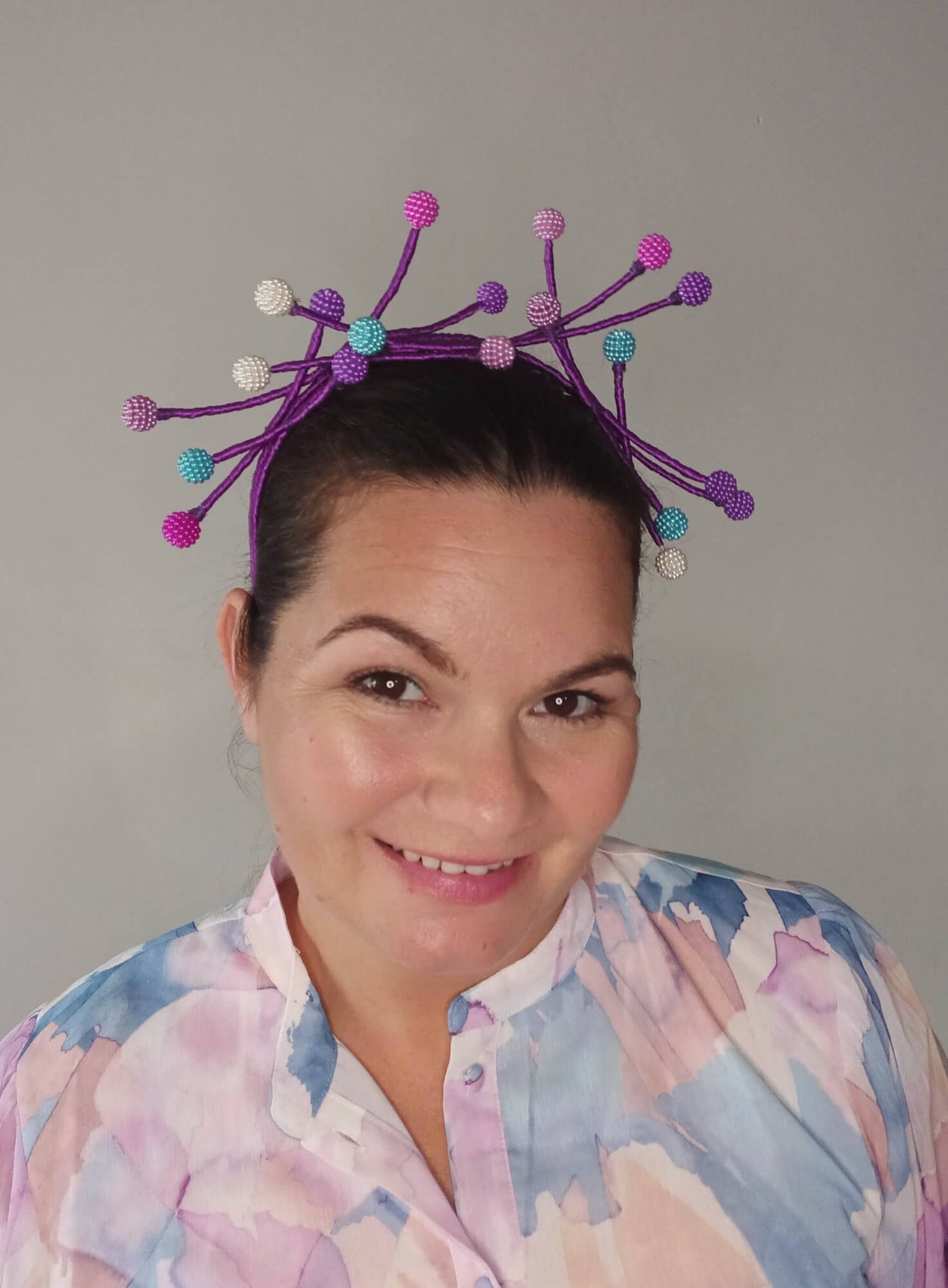 A picture of a Multi Coloured Beaded Millinery Headband by Melissa Rath Millinery.