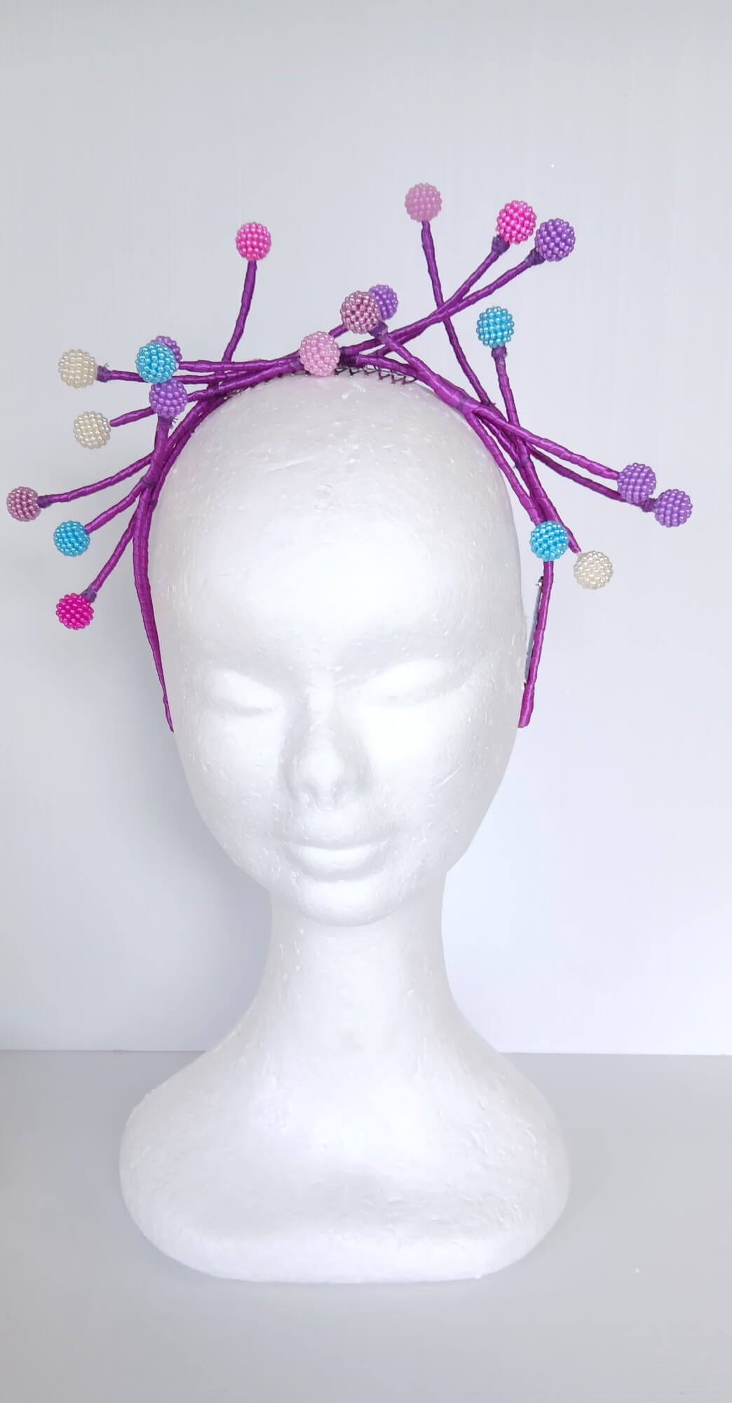 A picture of a Multi Coloured Beaded Millinery Headband by Melissa Rath Millinery.