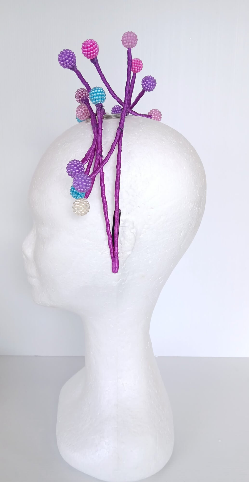 A picture of a Multi Coloured Beaded Millinery Headband by Melissa Rath Millinery.