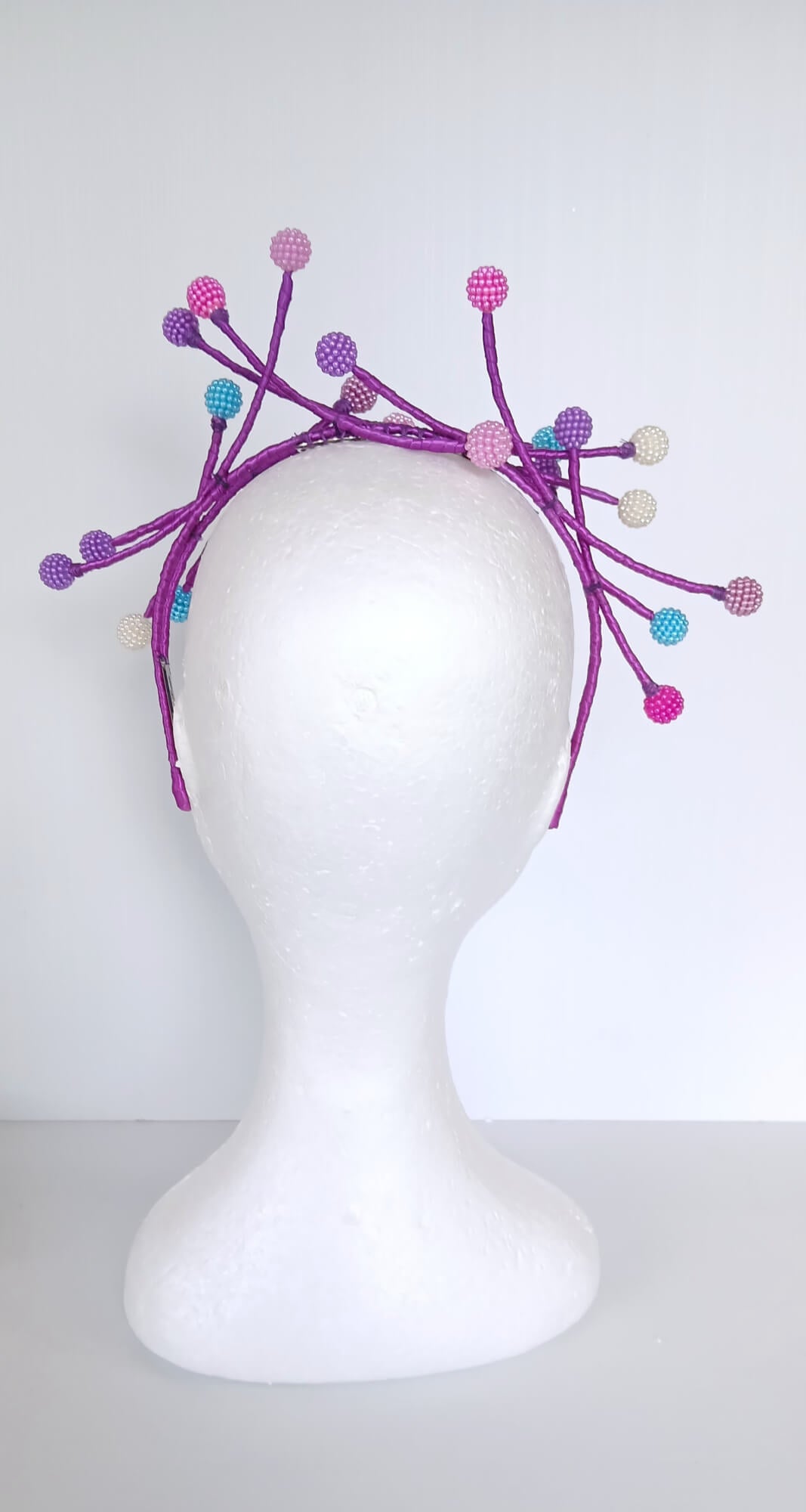 A picture of a Multi Coloured Beaded Millinery Headband by Melissa Rath Millinery.