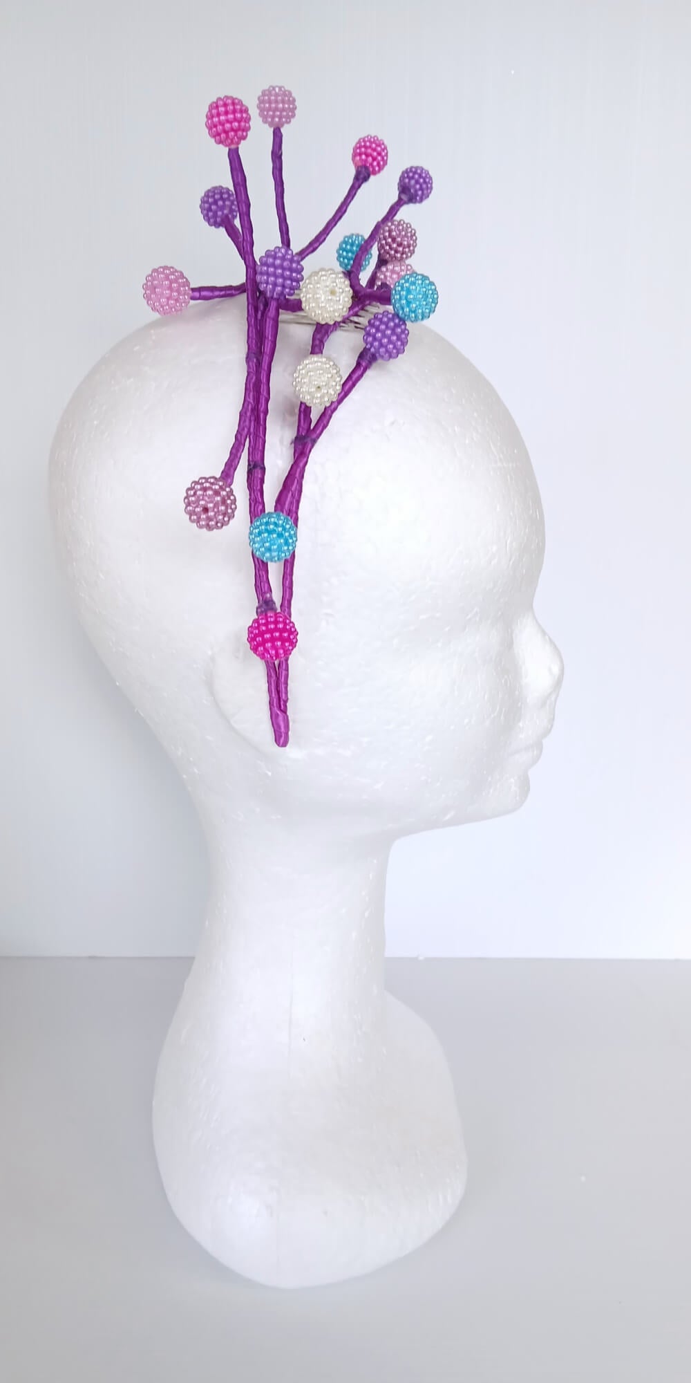 A picture of a Multi Coloured Beaded Millinery Headband by Melissa Rath Millinery.