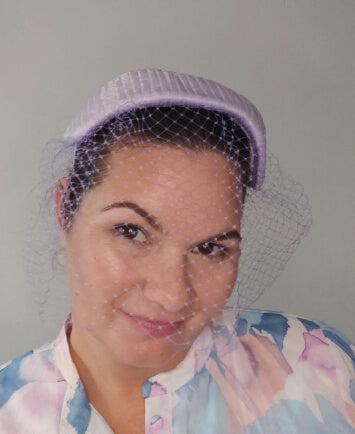 A picture of a Purple Veiled Pleated Organza Millinery Fascinator by Melissa Rath Millinery.