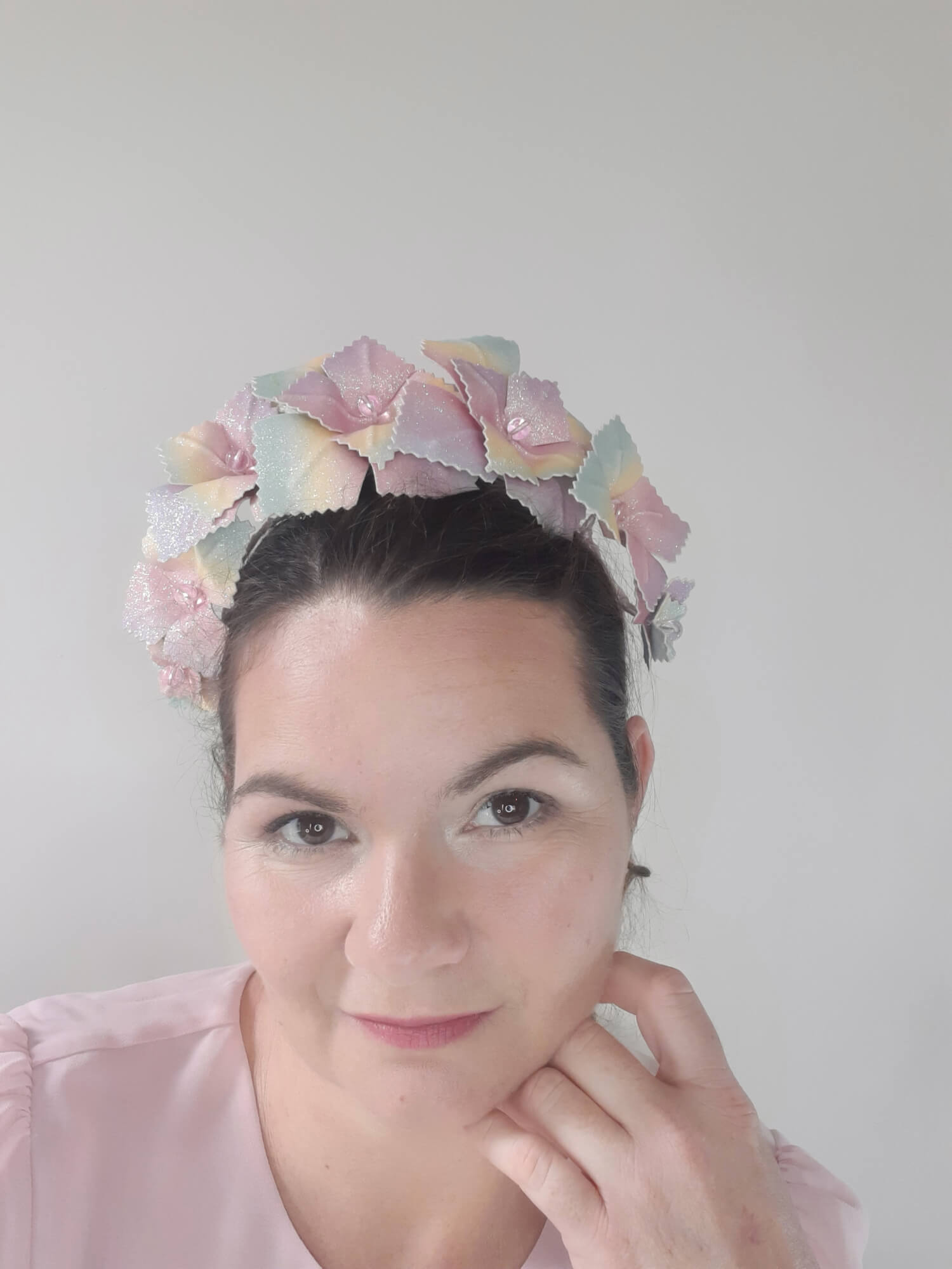 A picture of a Rainbow Pleather Millinery Crown by Melissa Rath Millinery.