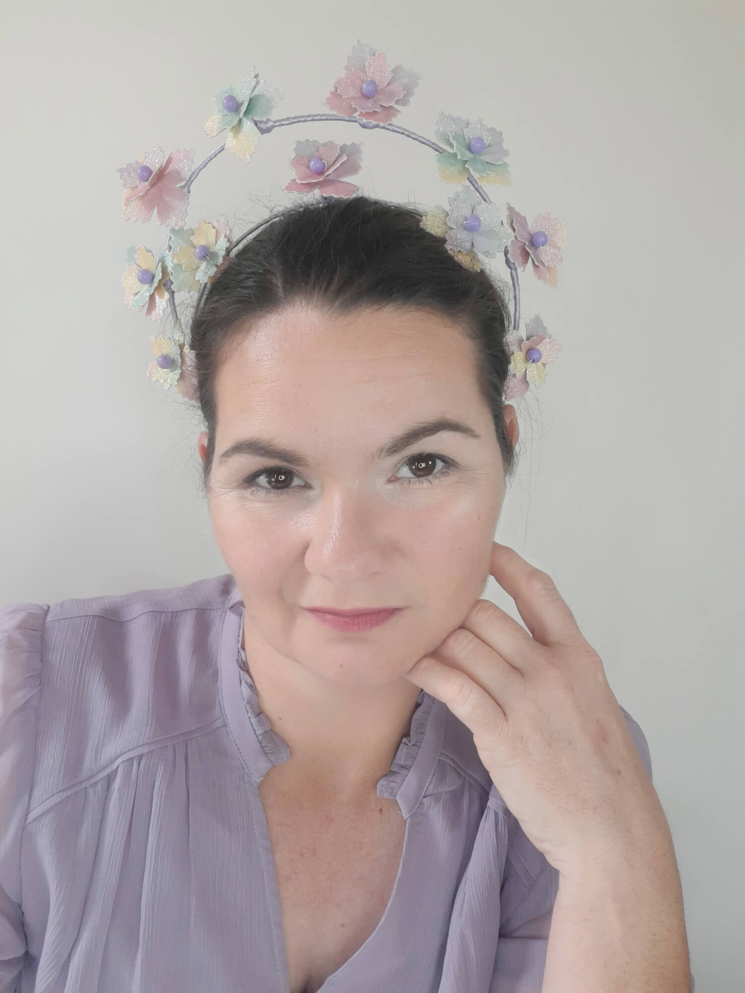 A picture of a rainbow millinery halo crown by Melissa Rath Millinery.