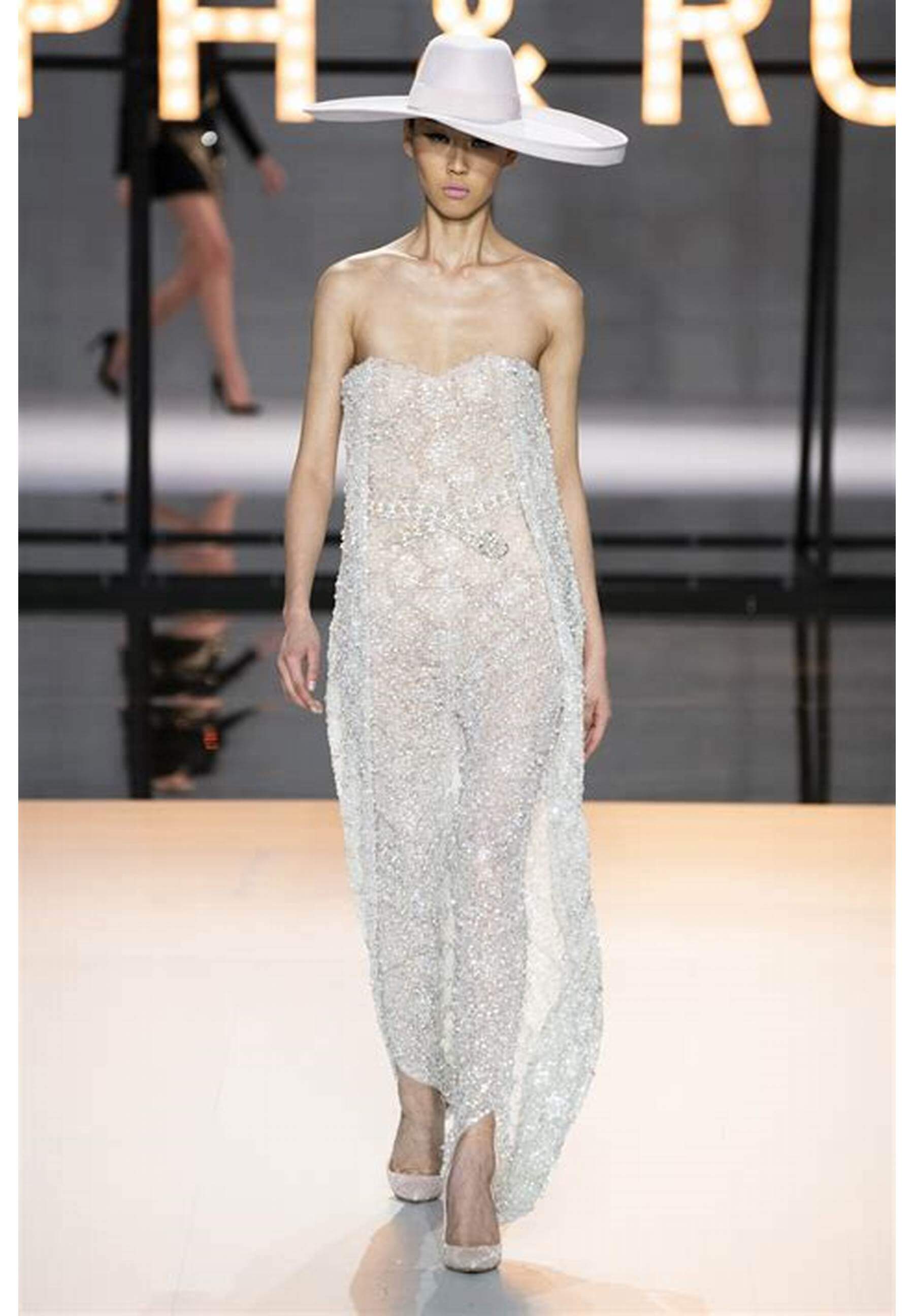 A picture of a model on the catwalk for Ralph and Russo 2019.