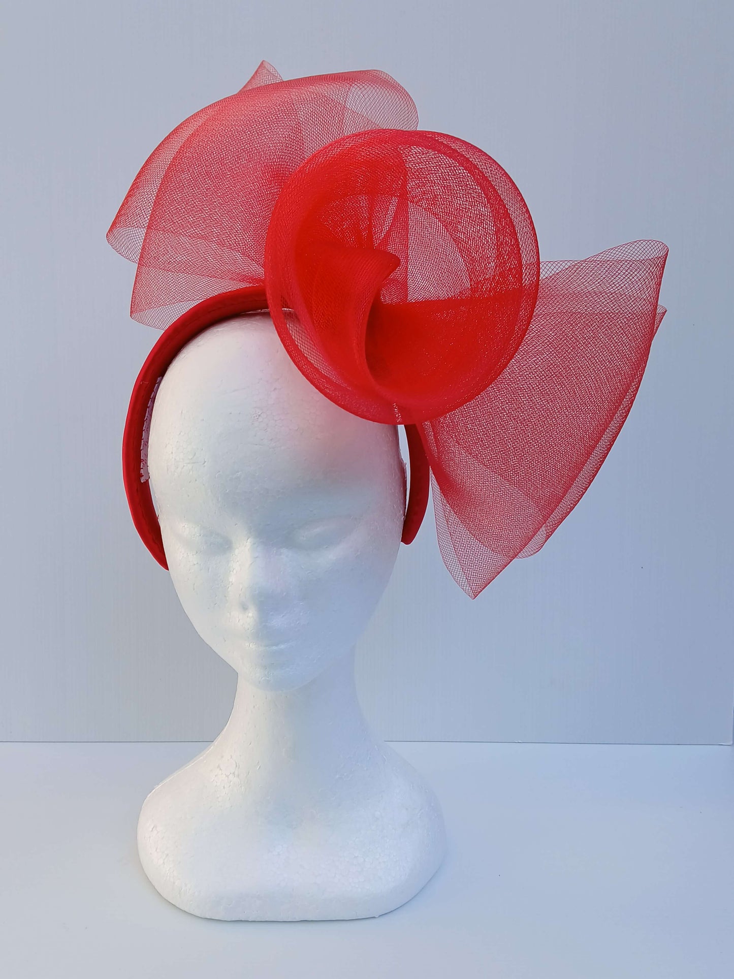 An image of a Red Padded Headband with Crinoline Bow and Rose by Melissa Rath Millinery