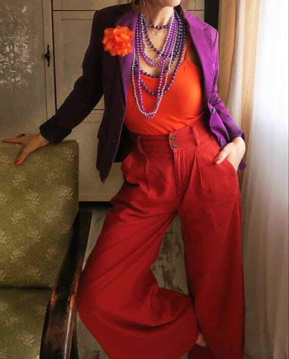 A picture of a woman wearing an outfit in a red analogous colour scheme.