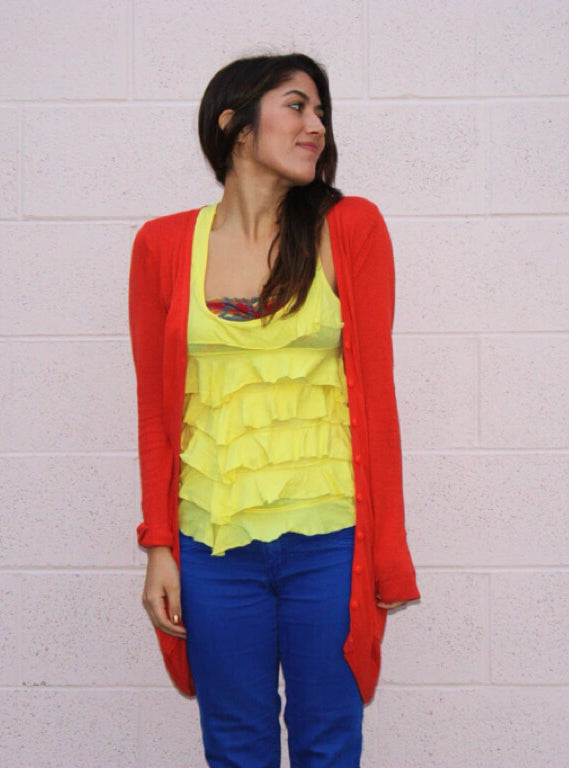 A picture of a woman wearing an outfit in a red triadic colour scheme.