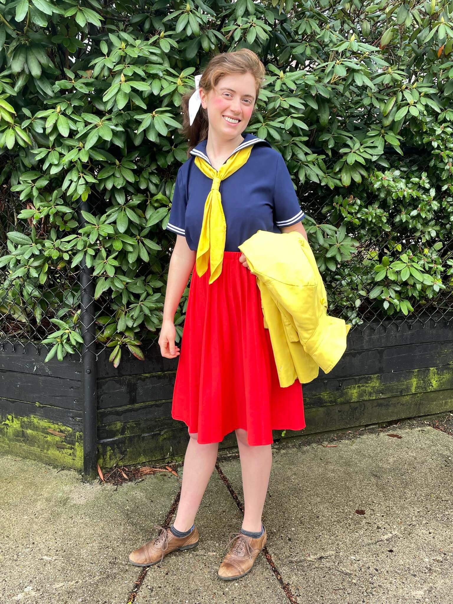 A picture of a woman wearing an outfit in a red triadic colour scheme.