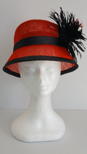 A picture of a red and black millinery cloche by Melissa Rath Millinery.