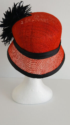 A picture of a red and black millinery cloche by Melissa Rath Millinery.