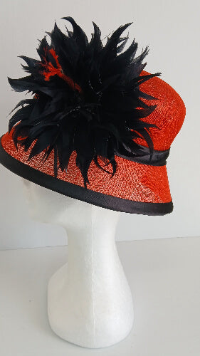 A picture of a red and black millinery cloche by Melissa Rath Millinery.