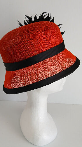 A picture of a red and black millinery cloche by Melissa Rath Millinery.