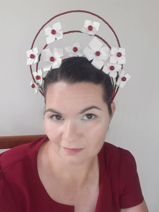 A picture of a Red and White Leather Millinery Halo Crown by Melissa Rath Millinery.