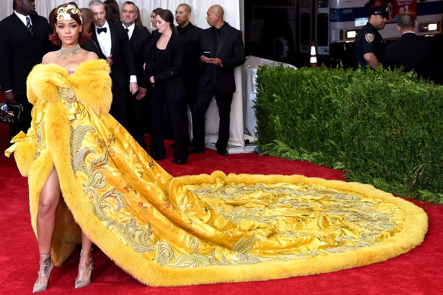 A picture of Rihanna wearing a bright yellow outfit to the 2015 Met Gala.