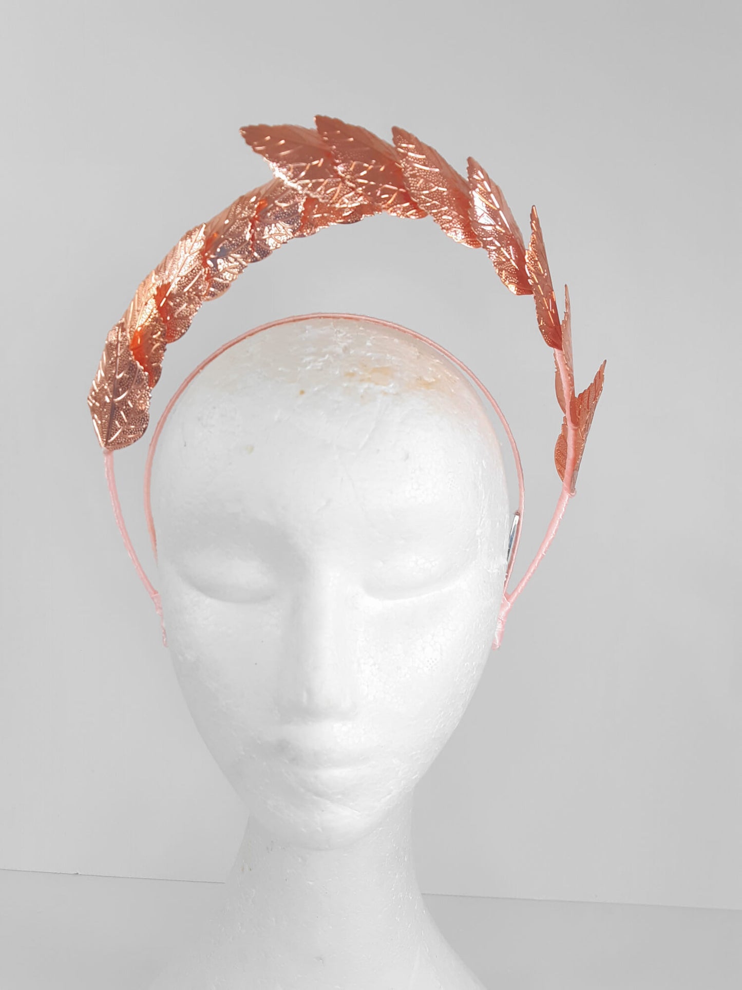 A picture of a Rose Gold Leaf Millinery Headband by Melissa Rath Millinery.