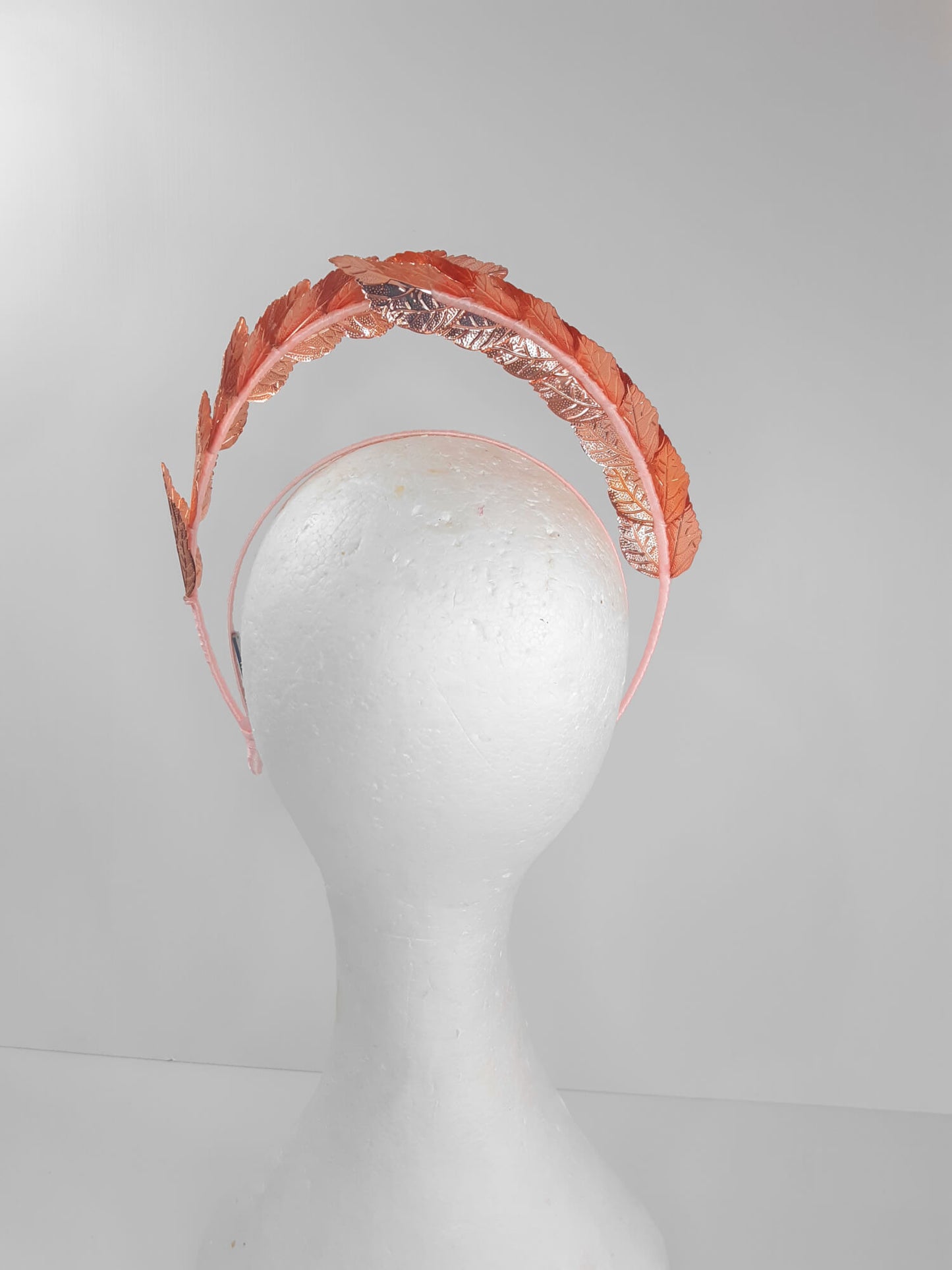 A picture of a Rose Gold Leaf Millinery Headband by Melissa Rath Millinery.