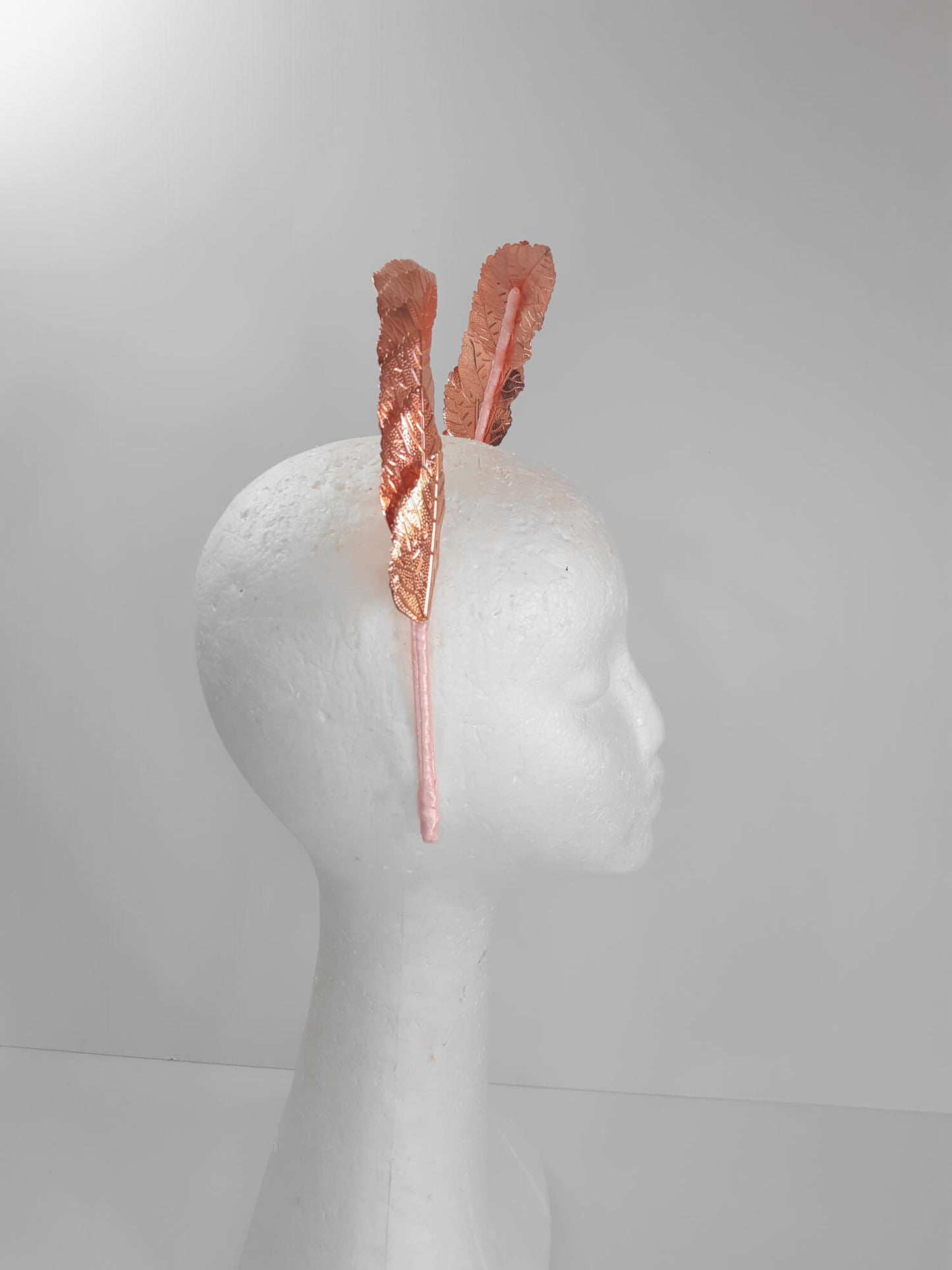 A picture of a Rose Gold Leaf Millinery Headband by Melissa Rath Millinery.
