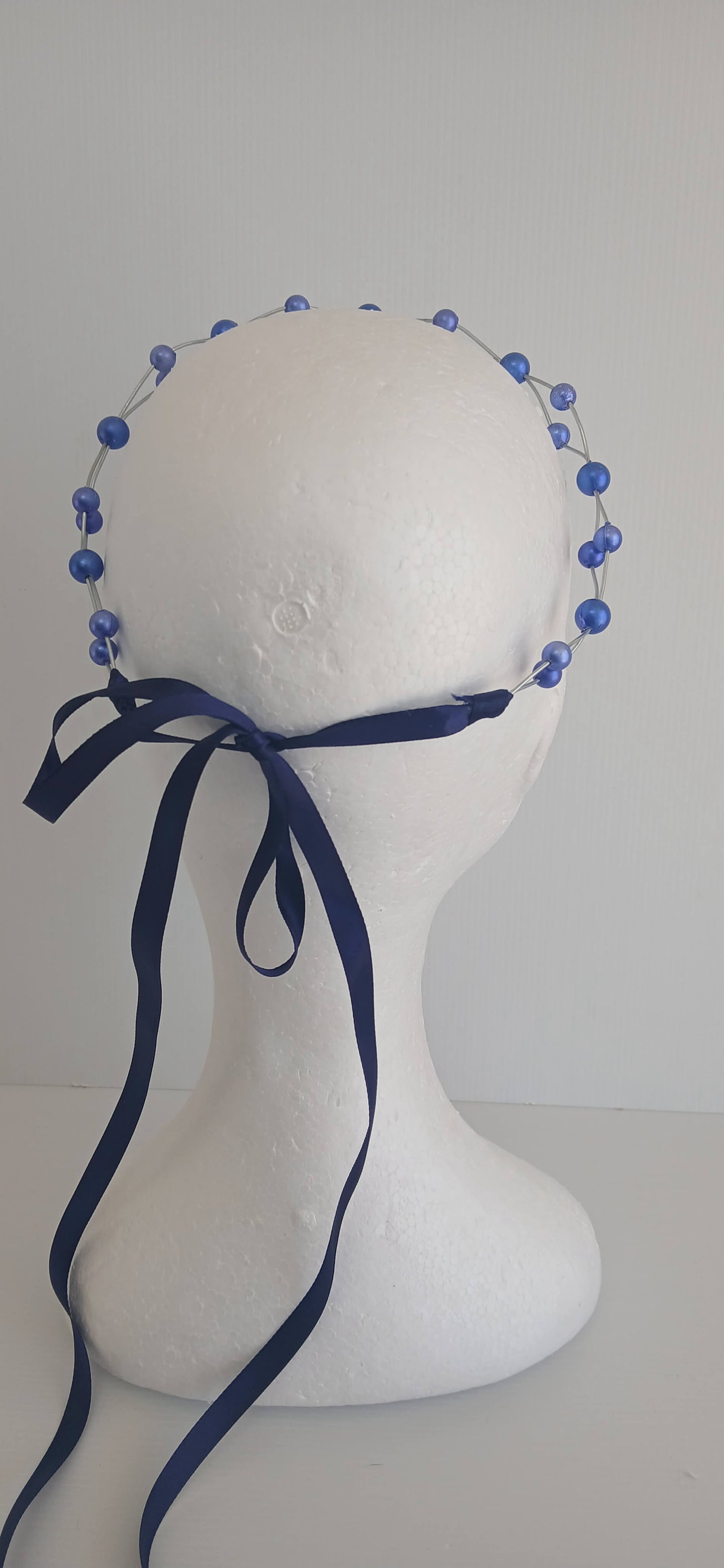 An image of the Royal Blue Beaded Halo Crown by Melissa Rath Millinery