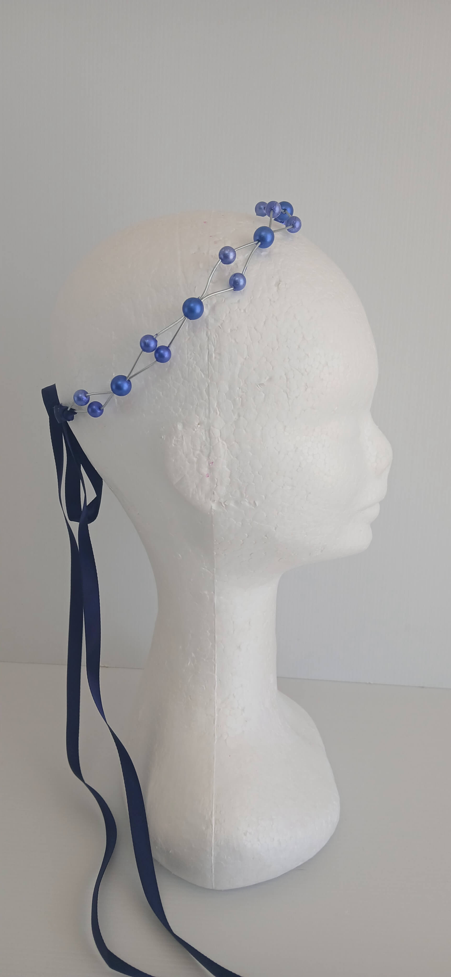An image of the Royal Blue Beaded Halo Crown by Melissa Rath Millinery