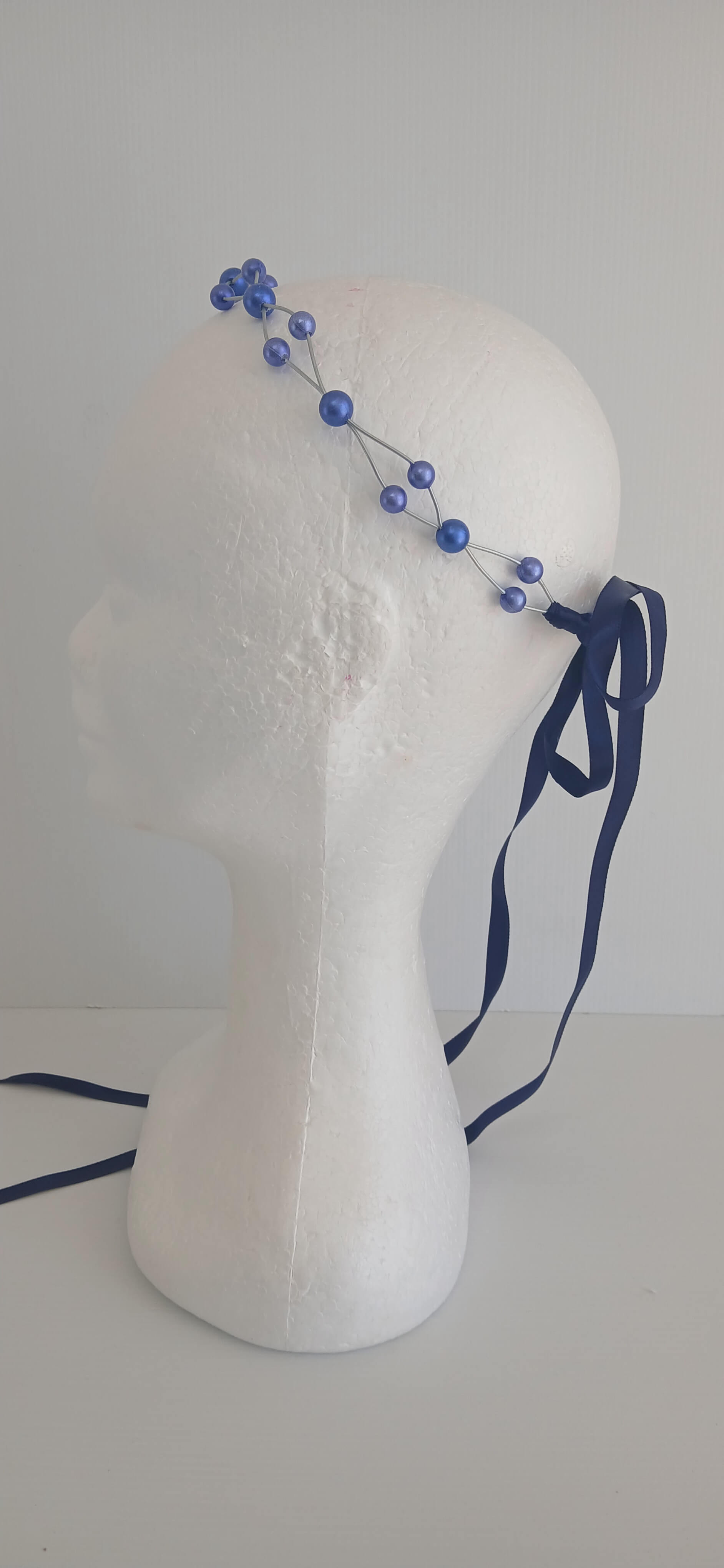 An image of the Royal Blue Beaded Halo Crown by Melissa Rath Millinery