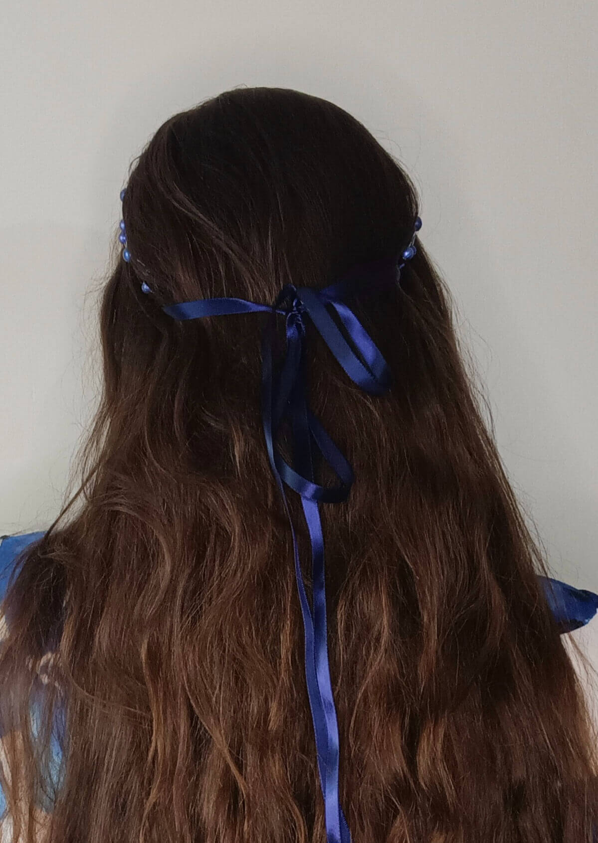 A picture of a Blue Beaded Halo Crown by Melissa Rath Millinery