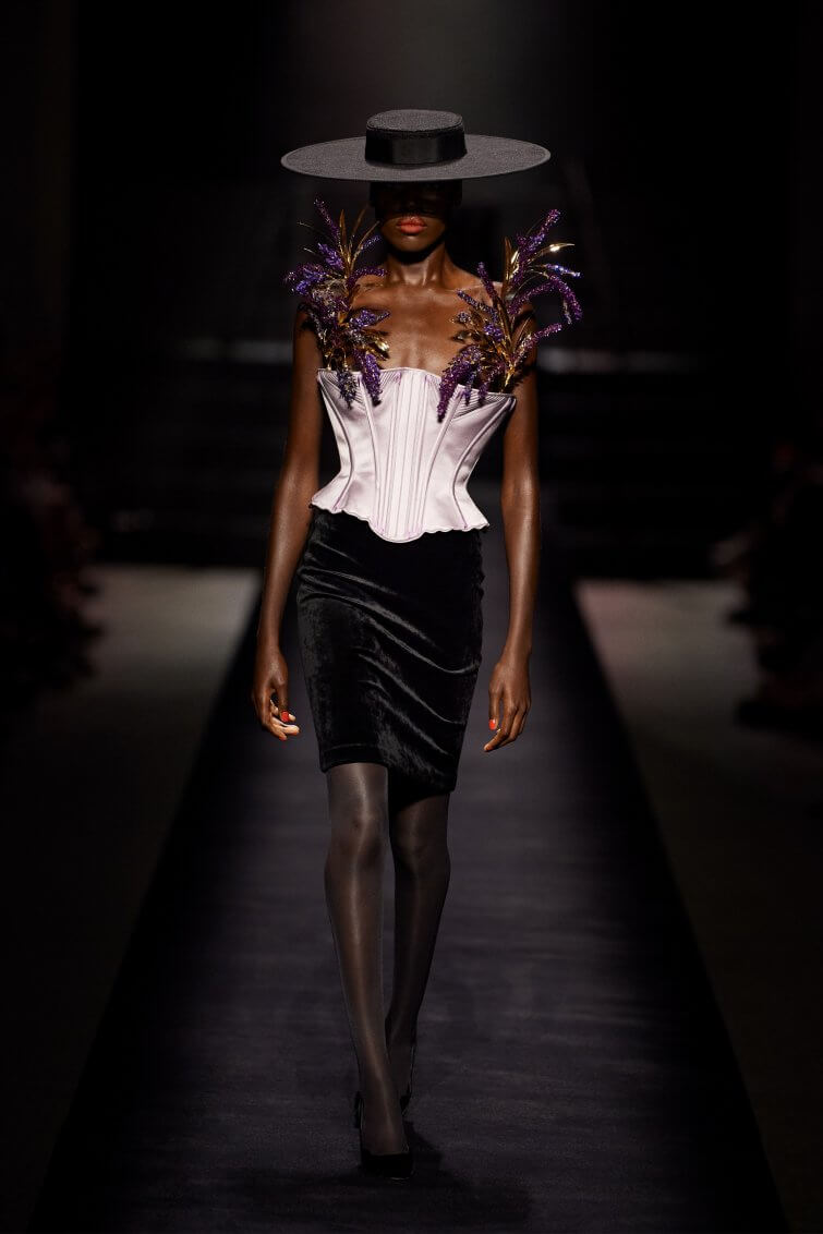 A picture of a model on the catwalk for Schiaparelli AW 2022.