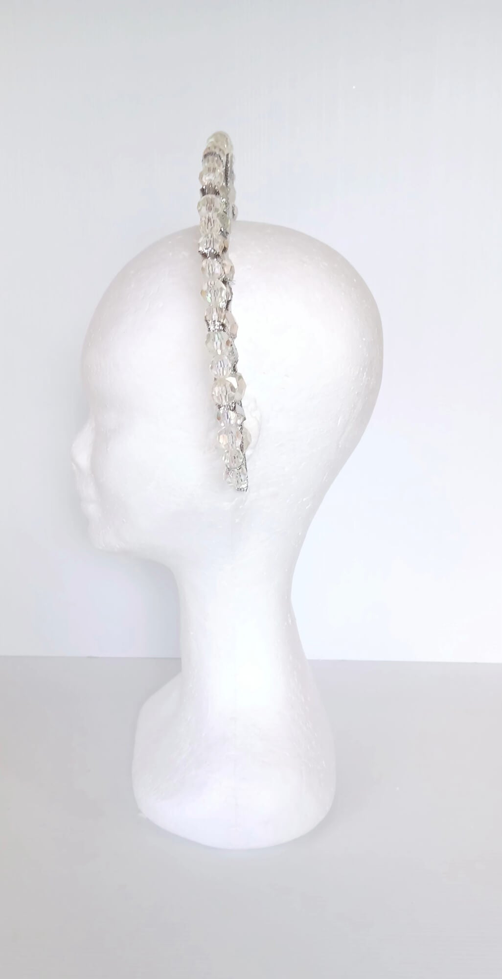 A picture of a Silver Double Ribbon Beaded  Millinery Headband by Melissa Rath Millinery.