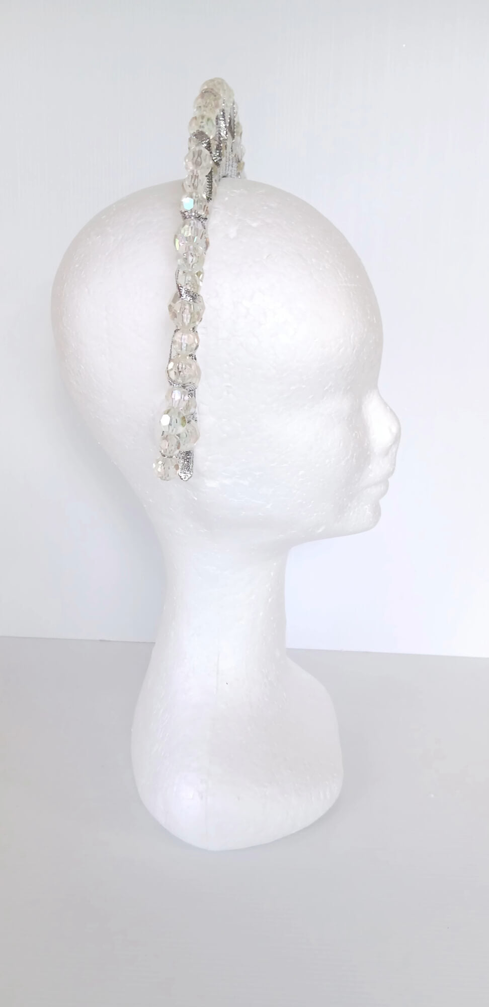 A picture of a Silver Double Ribbon Beaded  Millinery Headband by Melissa Rath Millinery.