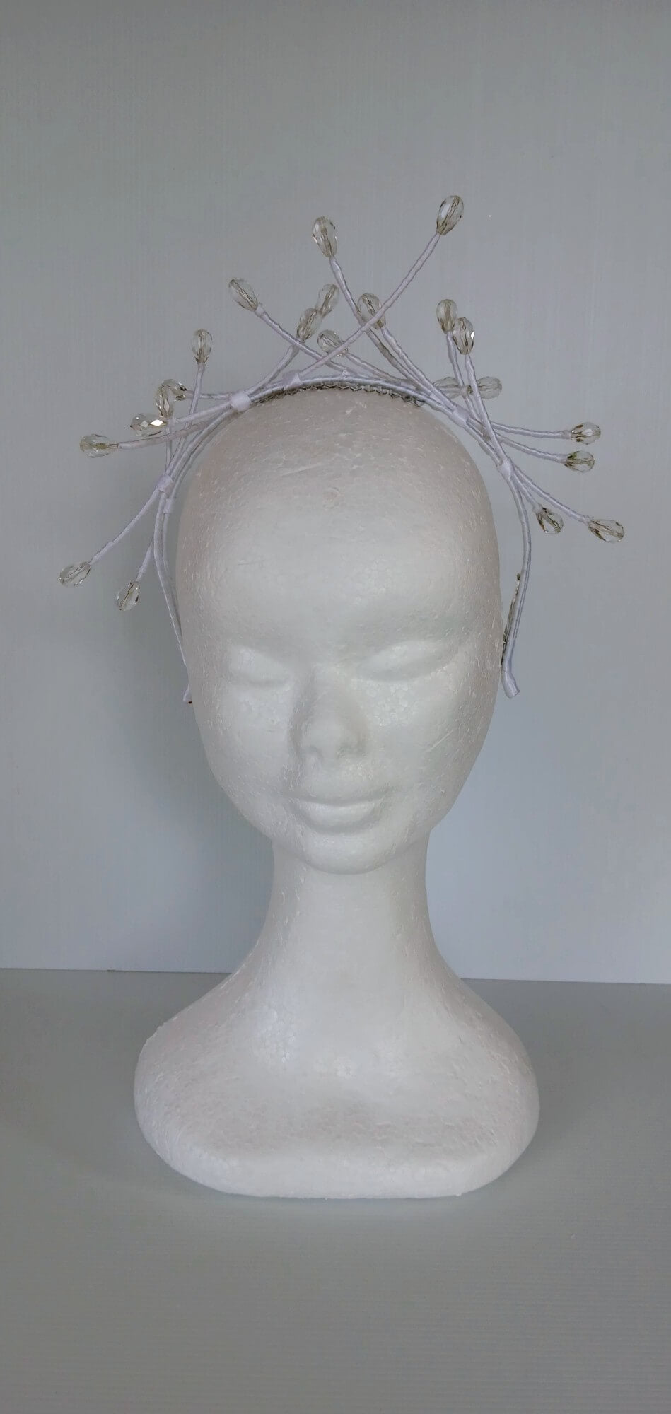 A picture of a White Beaded Millinery Headband by Melissa Rath Millinery.