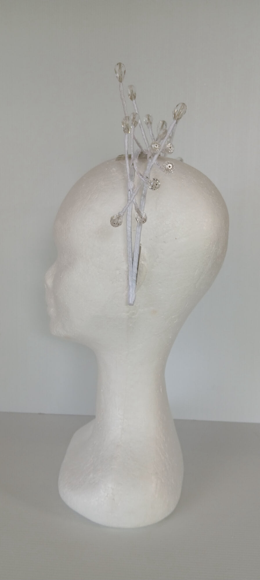 A picture of a White Beaded Millinery Headband by Melissa Rath Millinery.