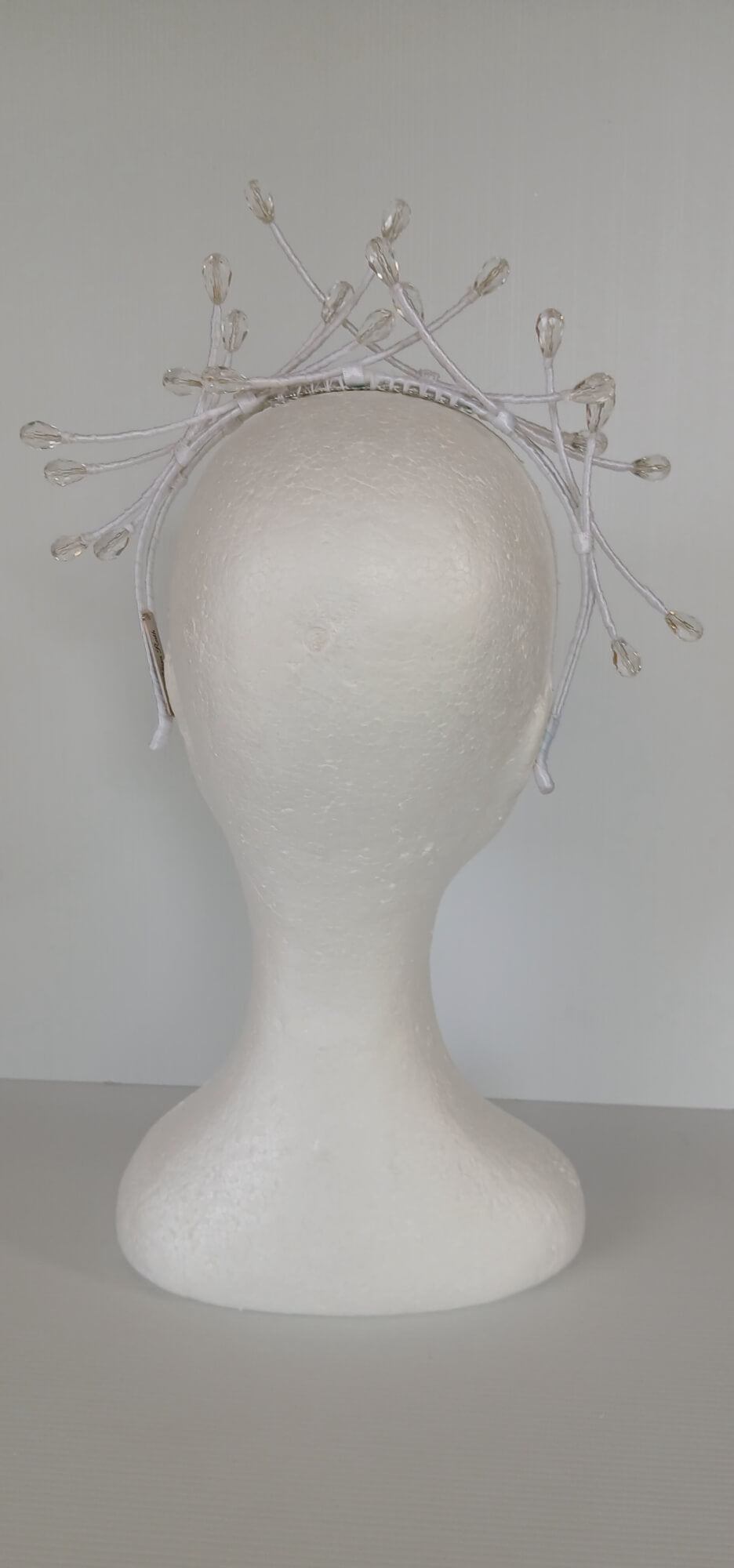 A picture of a White Beaded Millinery Headband by Melissa Rath Millinery.