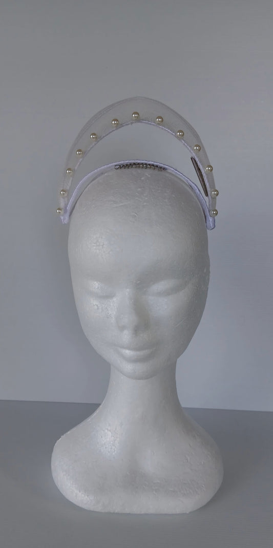 A picture of a White Crinoline Floating Millinery Crown by Melissa Rath Millinery.