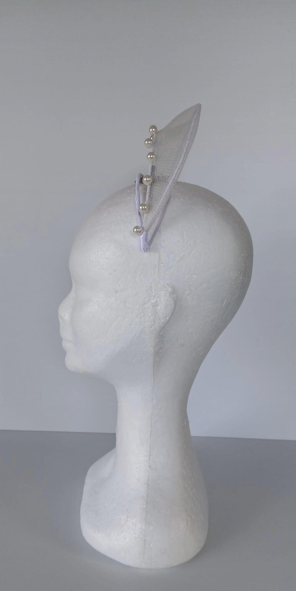 A picture of a White Crinoline Floating Millinery Crown by Melissa Rath Millinery.