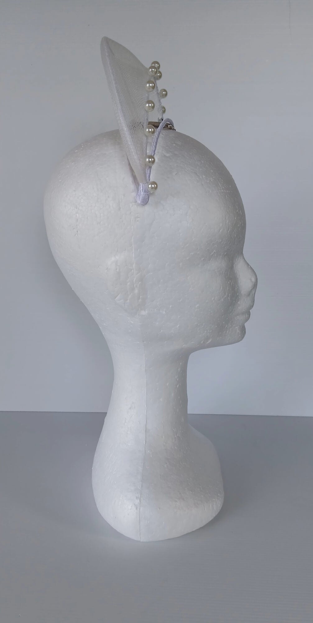 A picture of a White Crinoline Floating Millinery Crown by Melissa Rath Millinery.