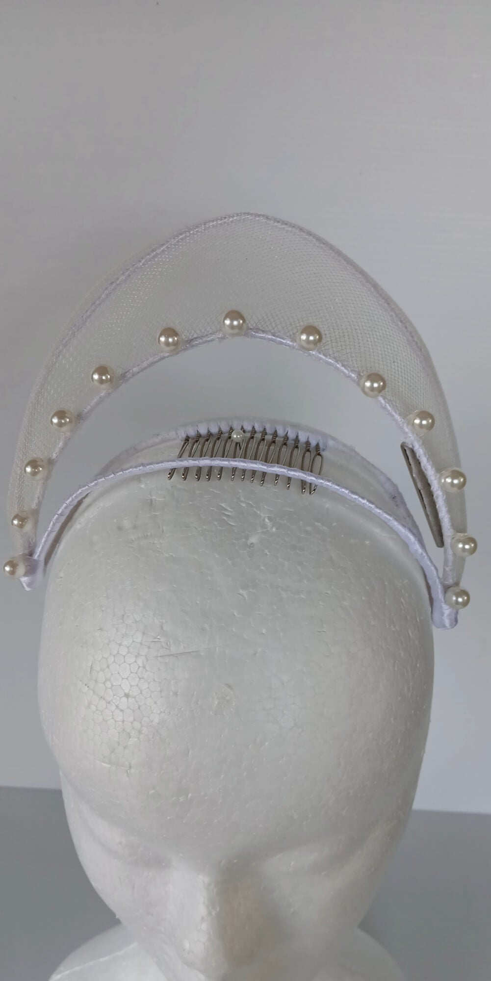 A picture of a White Crinoline Floating Millinery Crown by Melissa Rath Millinery.
