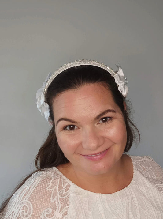 A picture of a White Floral Beaded Millinery Headpiece by Melissa Rath Millinery.