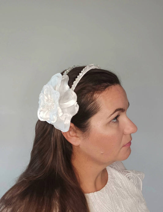 A picture of a White Floral Beaded Millinery Headpiece by Melissa Rath Millinery.