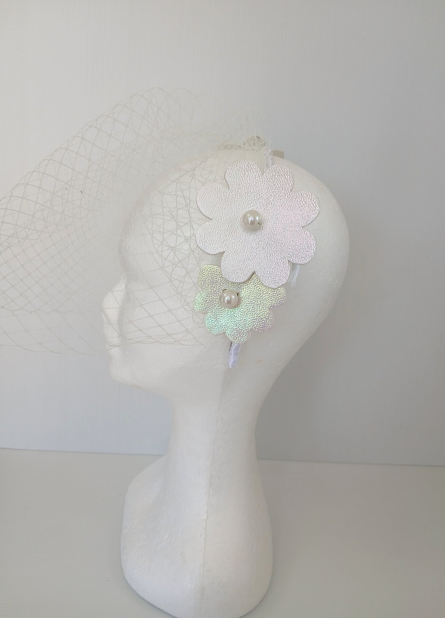 A picture of a White Pleather Headband by Melissa Rath Millinery