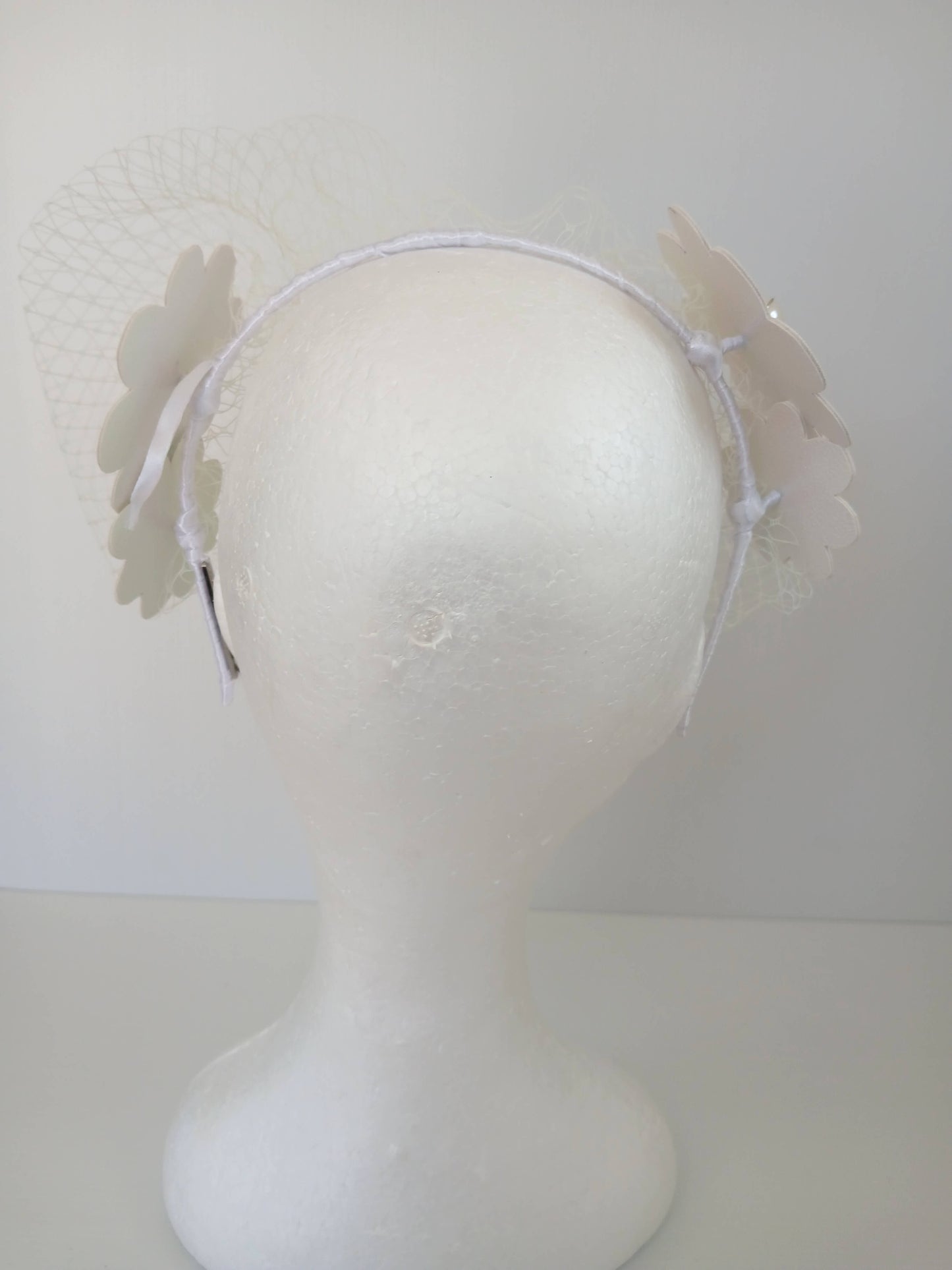 A picture of a White Pleather Headband by Melissa Rath Millinery