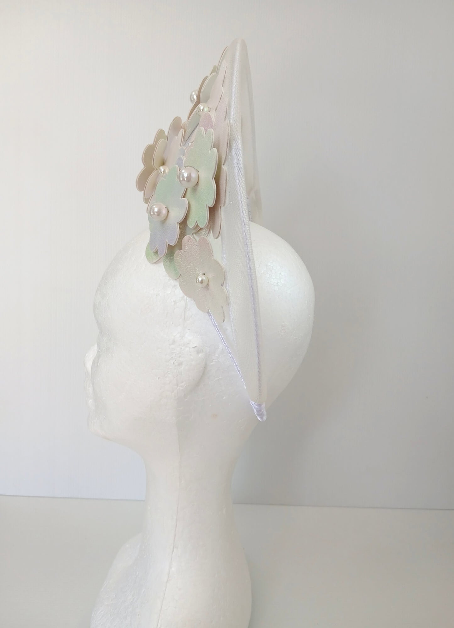 A picture of a White Pleather and Crinoline Millinery Halo Crown by Melissa Rath Millinery.