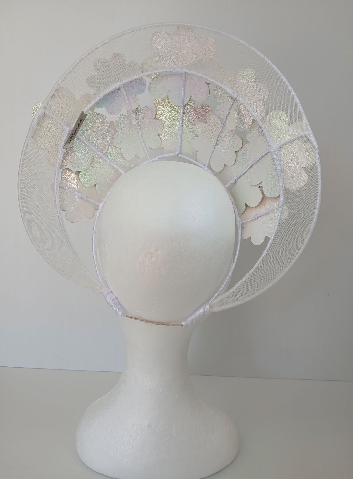 A picture of a White Pleather and Crinoline Millinery Halo Crown by Melissa Rath Millinery.